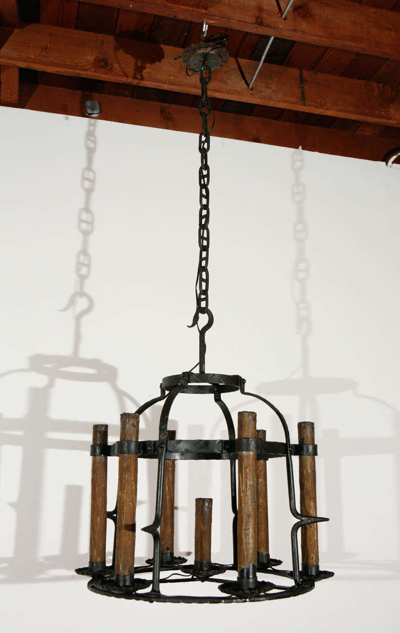 French iron chandelier with original wax candle covers (may be changed for new brass tubes); newly wired for seven standard sockets up to 75 watts each.