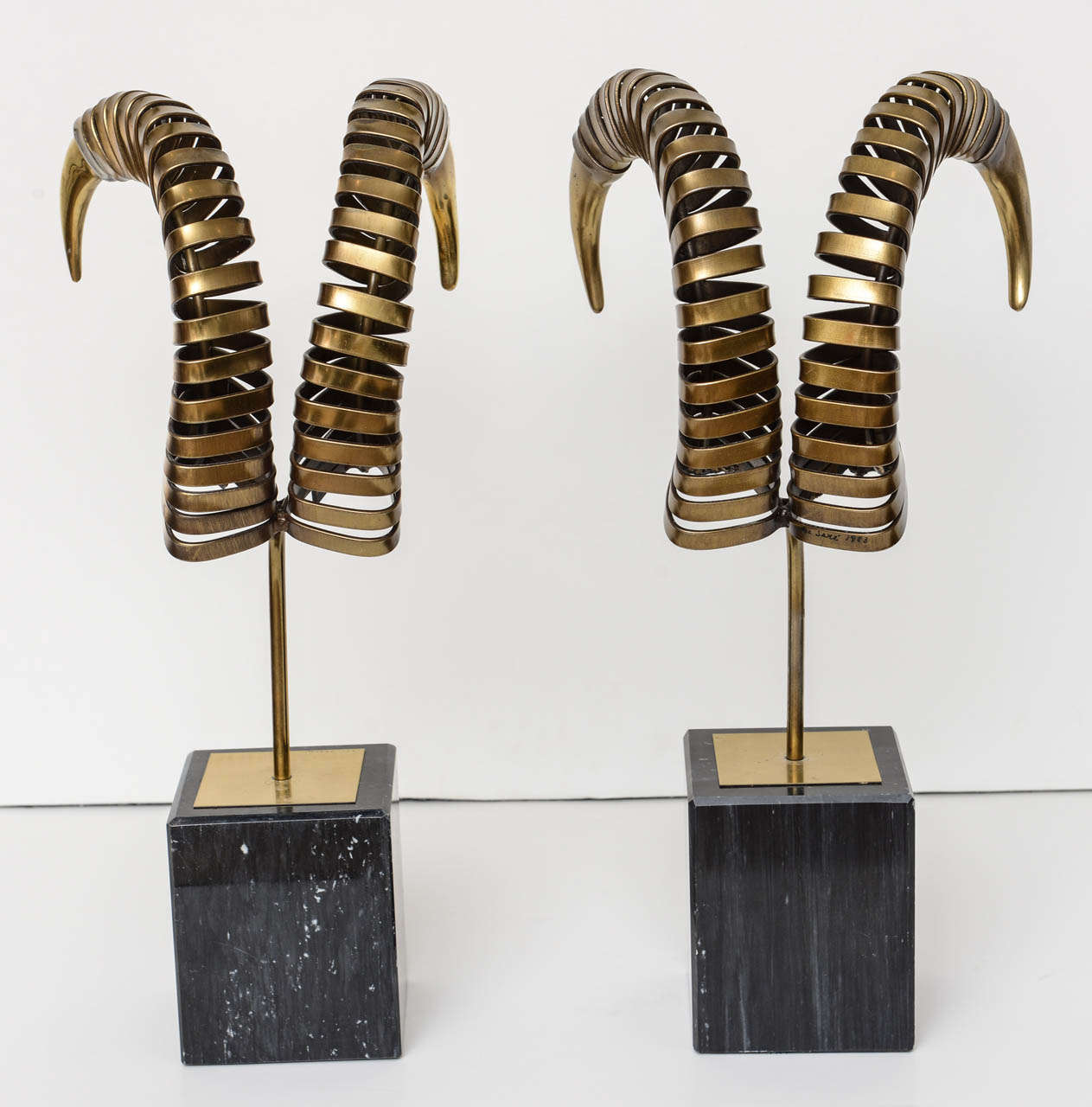 Great pair of brass and marble base ram`s horns by Curtis Jere.
 Signed 1983.
