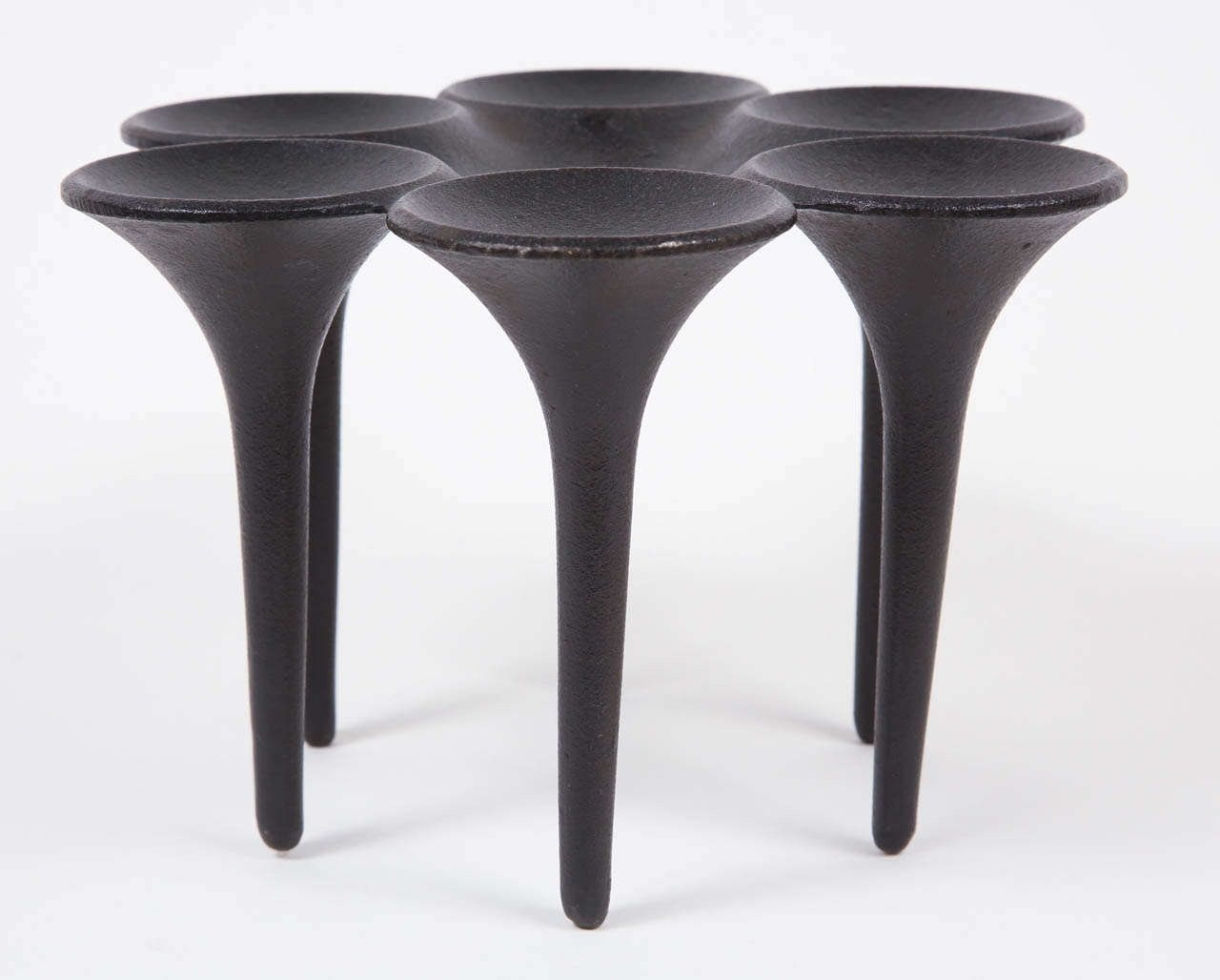 A beautifully rendered cast iron candleholder, for 3/4