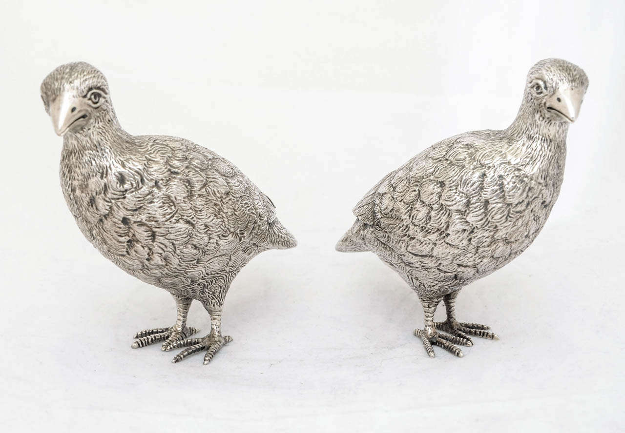 A pair of English sterling silver models of partridge, hallmarked in London 1977, and made by L.A.Galvin. These realistically modelled birds are solid silver with no filling and each bird faces in opposite directions.
The total weight is 505gms;