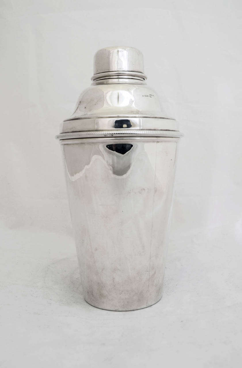 An English sterling silver cocktail shaker made by James Dixon & Sons in the City of Sheffield in 1936.