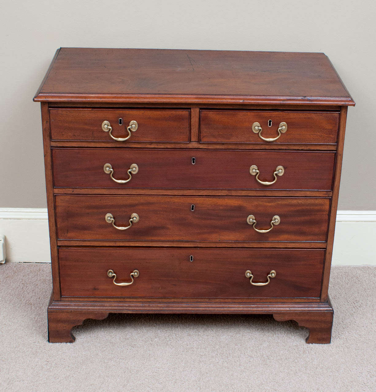 This two over three drawer Chippendale style chest has an old finish cleaned and restored by us -- very accommodating size. This chest has a more than 50 year history in this country, it was purchased from a Middleburg, Virginia dealer in the early