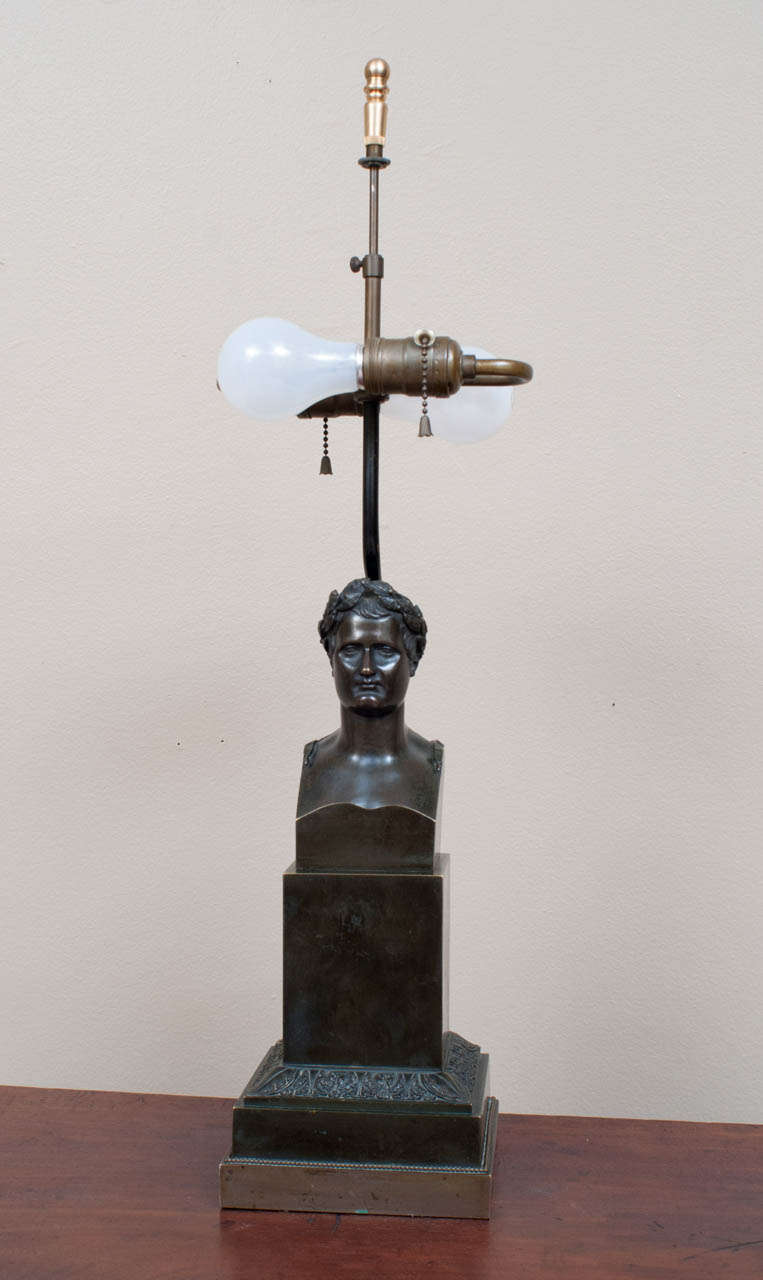 This exquisitely hand-cast bronze was made in Italy or perhaps France after the   statue by Canova in the mid-19th Century. It was expertly turned into a lamp in the 1930s. The patinated brass tubing curves around Napoleon's head and disappers into