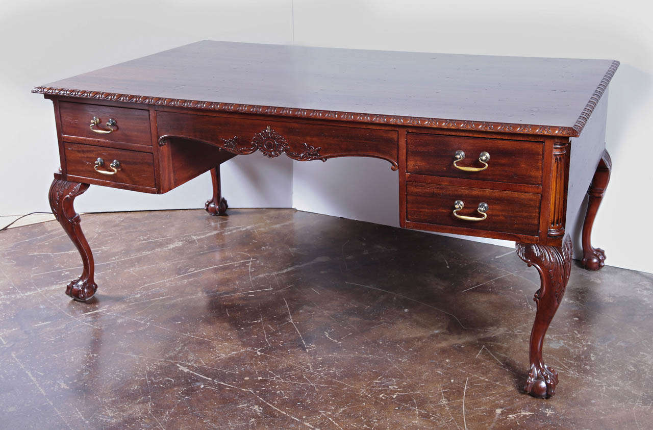 Late 19th c English Chippendale mahogany large partners desk. Beautiful gadrooned carved edges. Acantus carved knees ending in  ball and claw feet