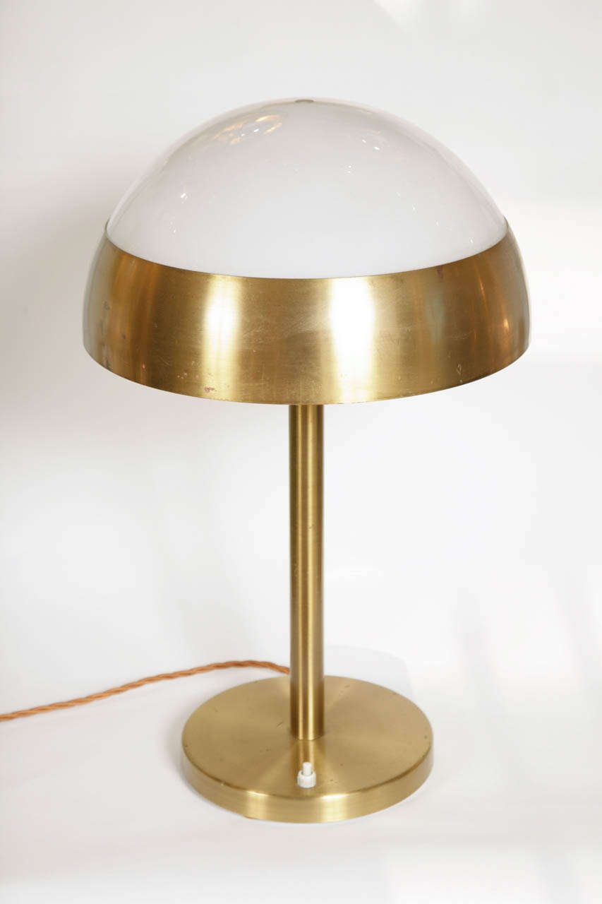 Reprisal of the classic 1930s Domed Lamp by Jean Perzel, attaining high light intensity while avoiding eye strain through evenness of surface area – brushed brass and white glass.