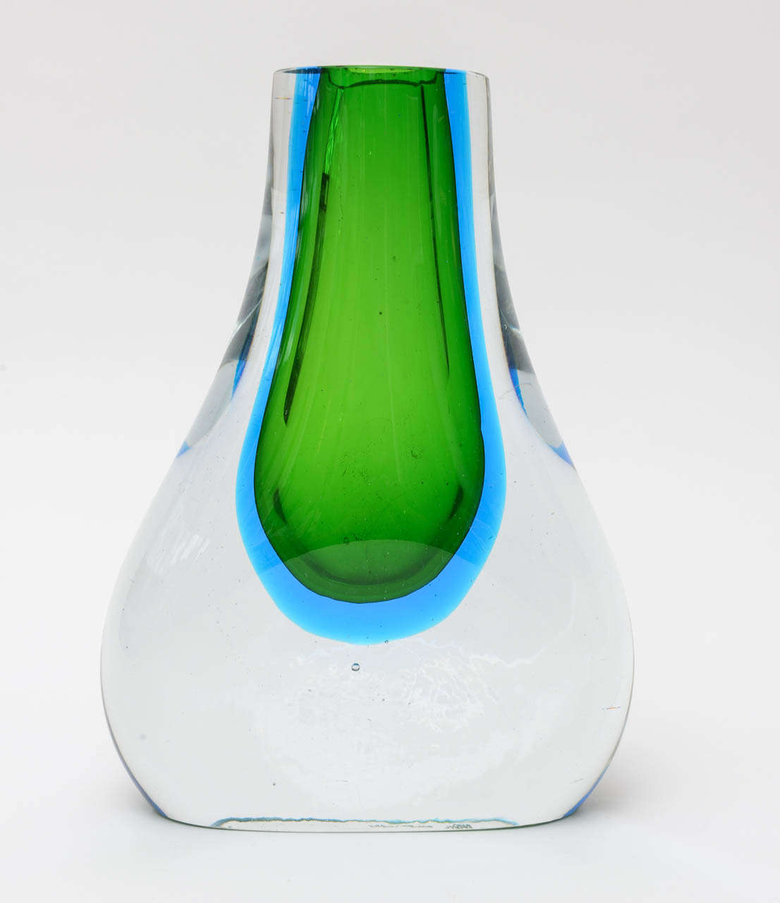 The amazing colors of this signed Blenko glass vase/object has the luscious colors of sommerso  glass in sapphire turquoise blue and  kelly green and clear.
The bottom is flat.
Truly, a stunner....
