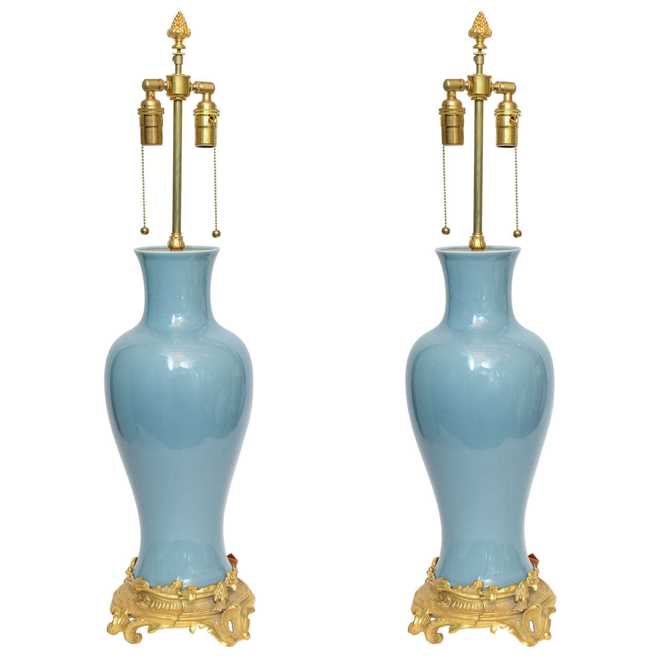 A pair of powder blue glazed Chinese porcelain bronze base mounted lamps. Height - 22