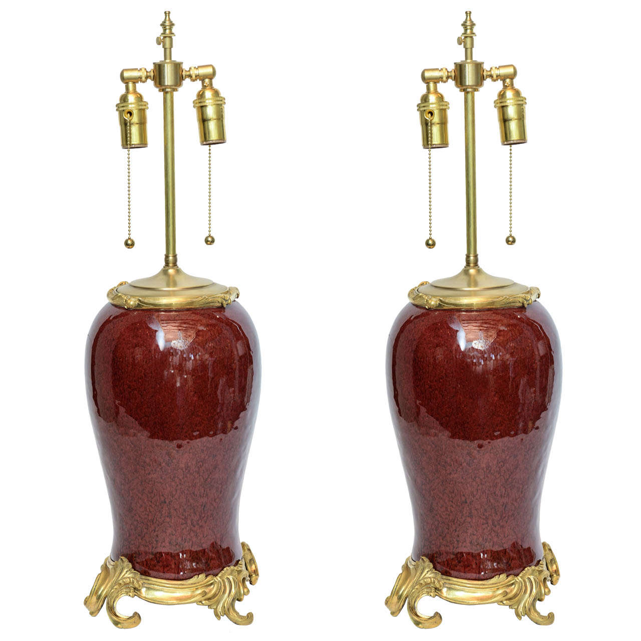 A pair of French bronze-mounted Chinese oxblood porcelain vases. Porcelain is from 18th century and mounts are from 19th century. Measures: Height 16