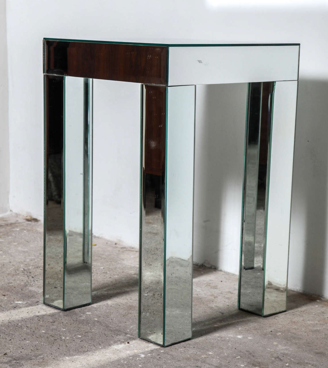 Pair of squared side tables of faceted mirrored glass. Crafted from hardwood solids and wood composite. Antiqued faceted mirror inlays on the top and all sides.