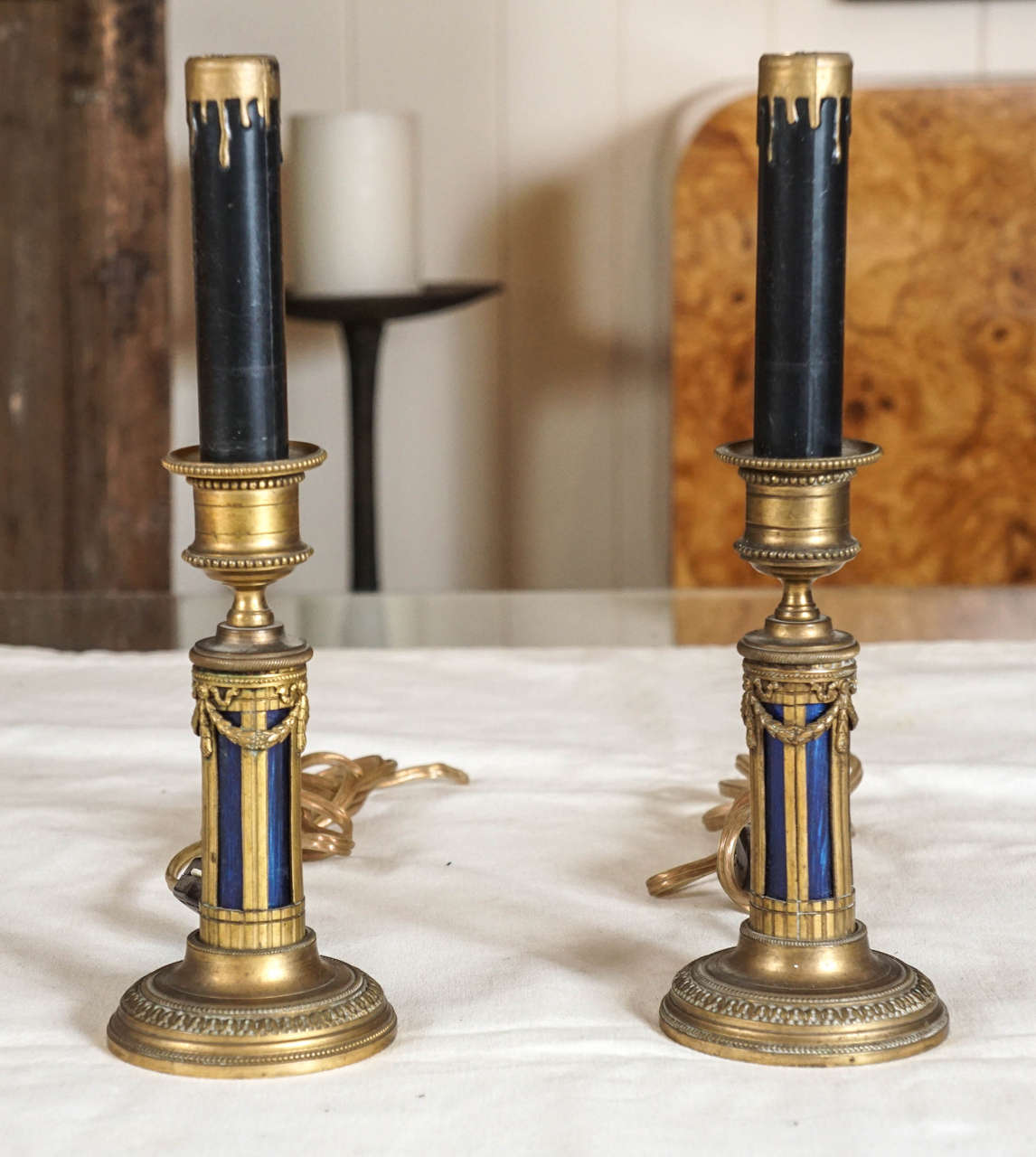two metal candlestick holders retrofitted into table lamps, Louis XVI style from the 1920's.