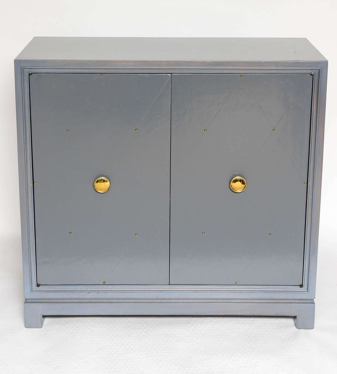 Identical from the outside, this pair contains one cabinet with shelving and one with drawers. Label to interior.