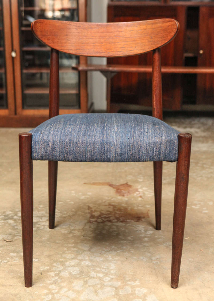 Mid-century set of six blue upholstered dining chairs with tapered legs. 