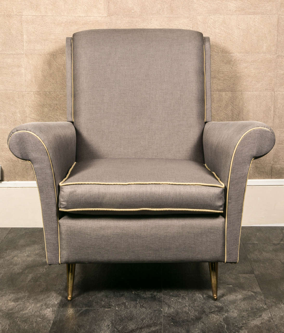 Elegant pair of 1950 Italian armchairs.
Brass legs, newly upholstered.