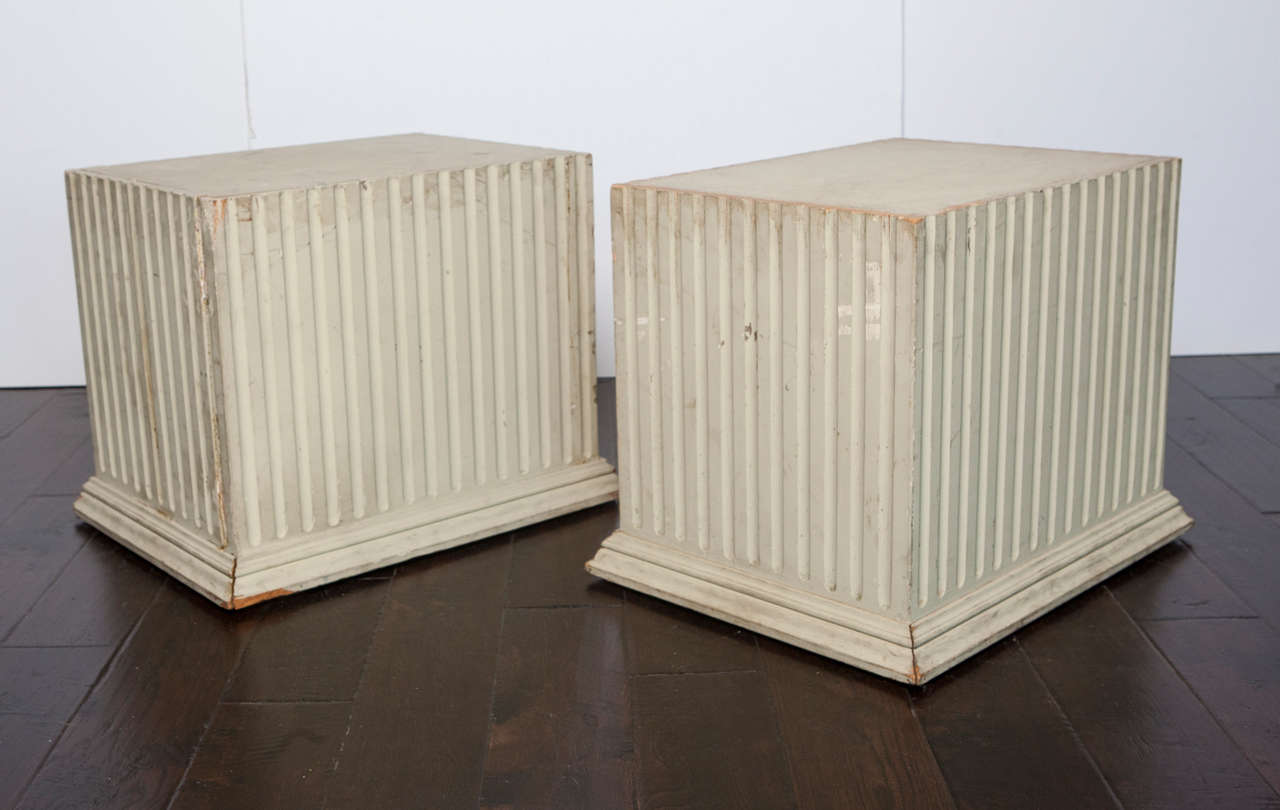 Celadon painted ribbed pedestals.