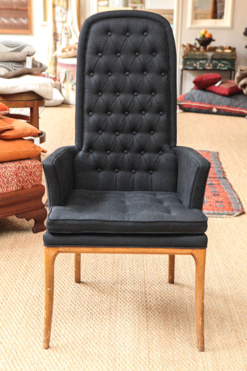 Circa 1960s arm chair with original finish and contemporary black linen upholstery.  Original silk label. Sold Separately, one available.