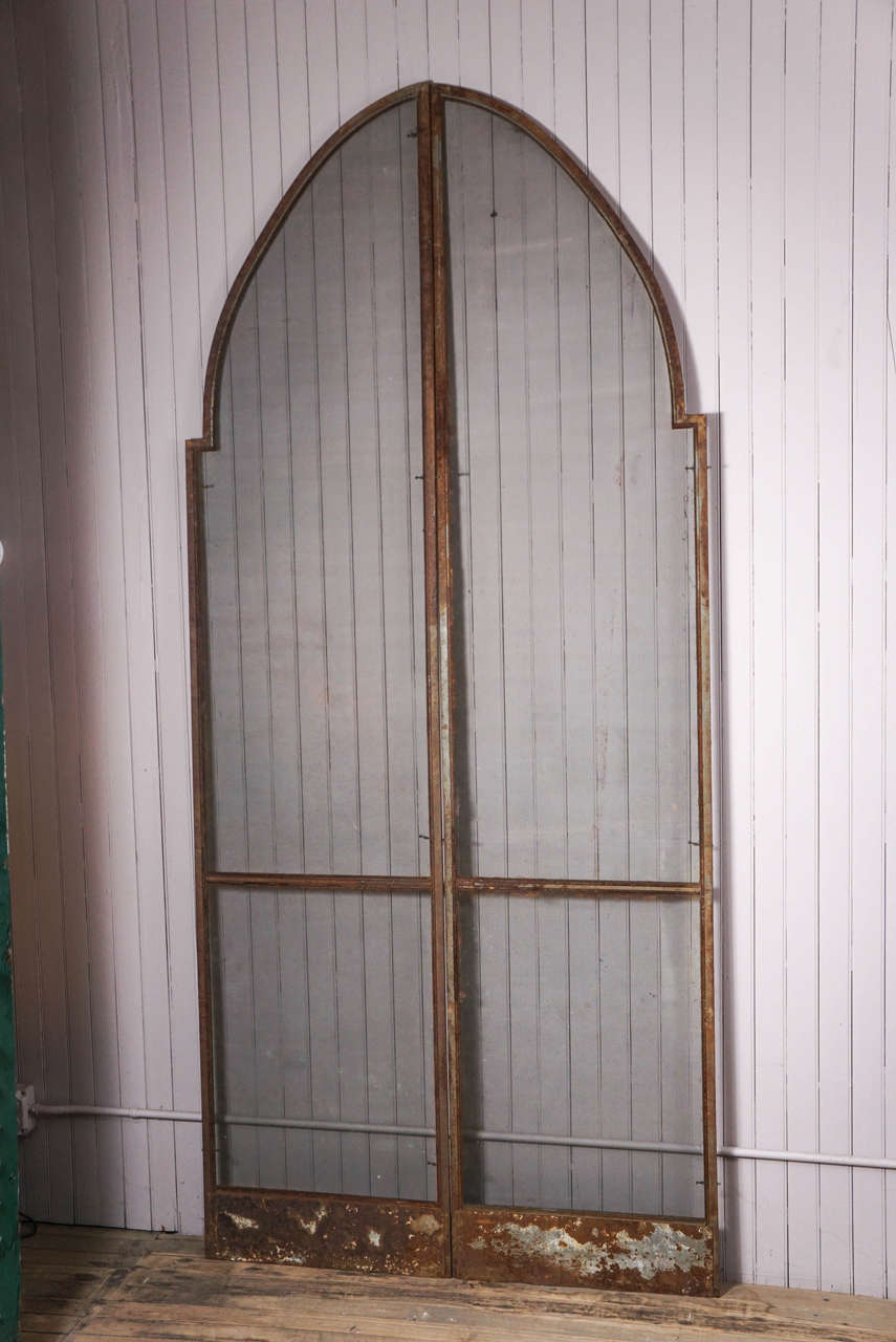 Two pair of metal Gothic screens, rusted surface patina. Sold as two pair.