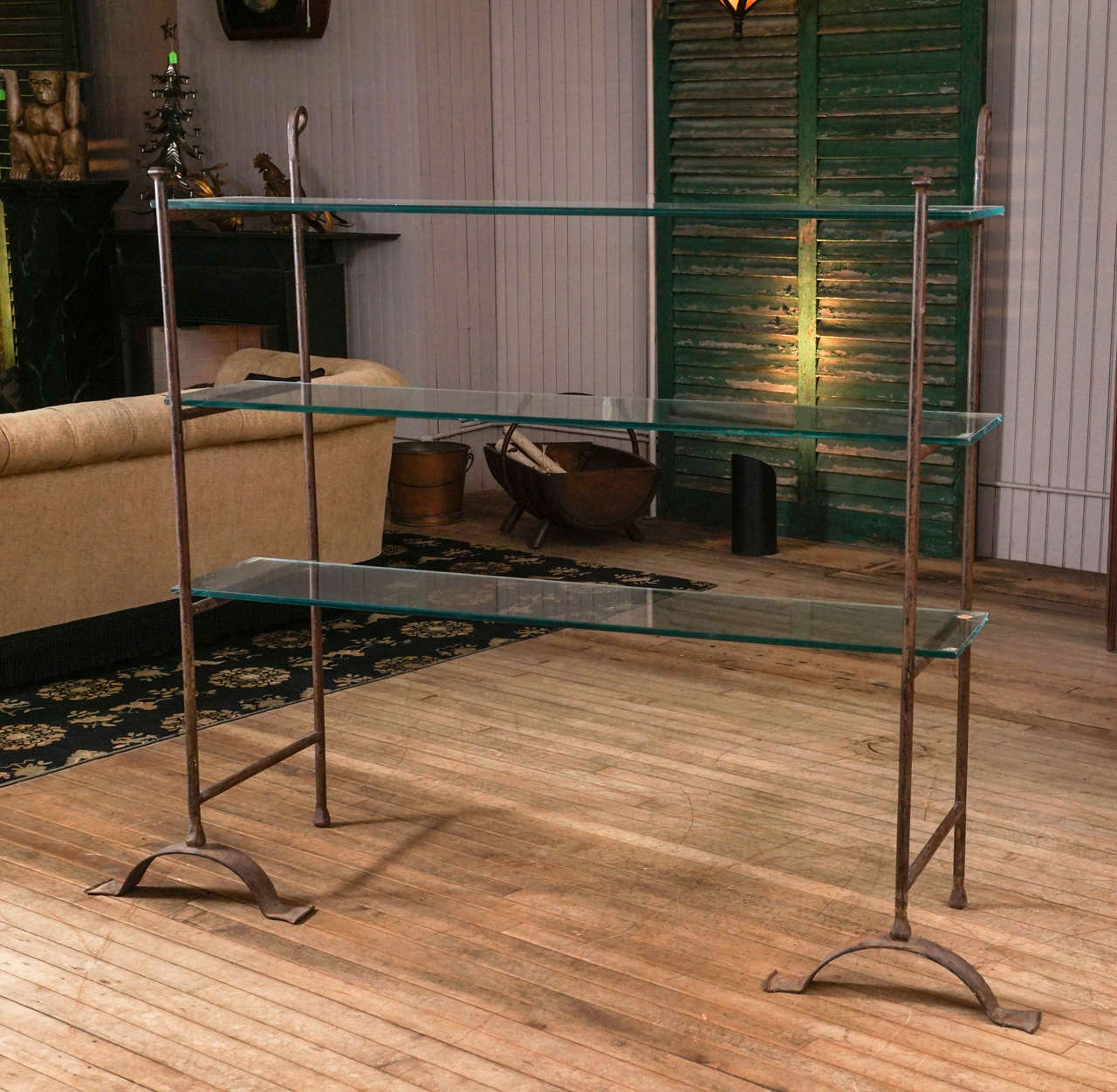 Pair of wrought metal stanchions for holding shelving. Shelving of material and length of your choice, glass in pic just for exhibit purpose, holds four shelves.