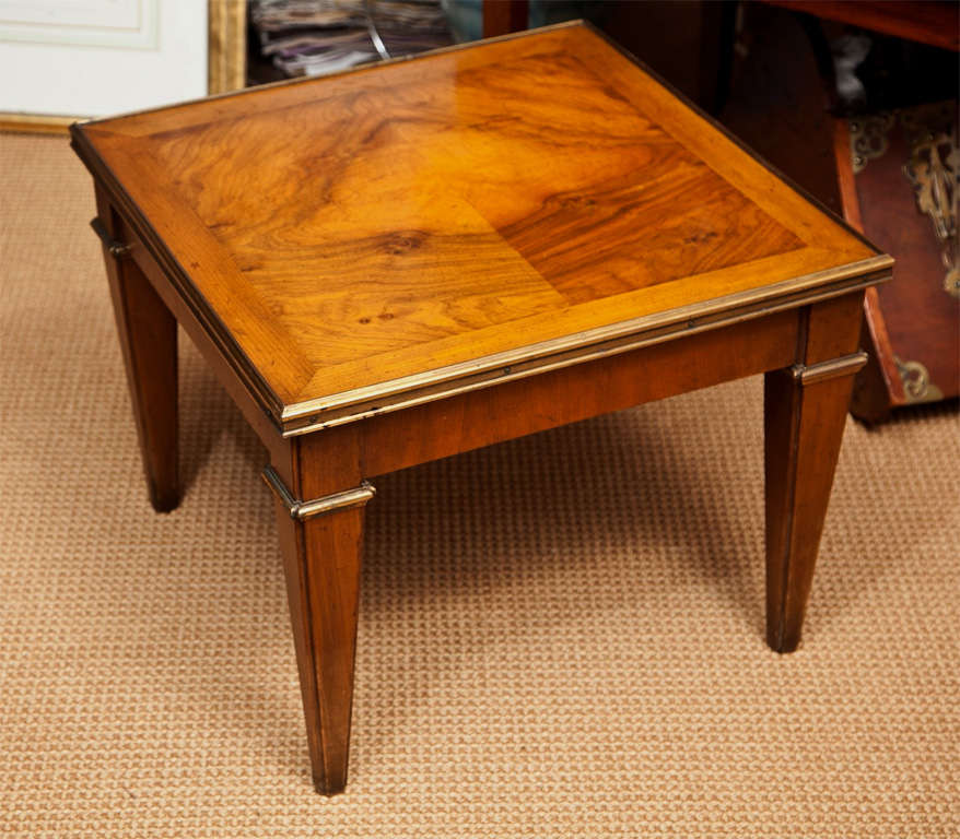 A perfect example of the quality of Baker Furniture.  Solid wood low side table trimmed in brass.