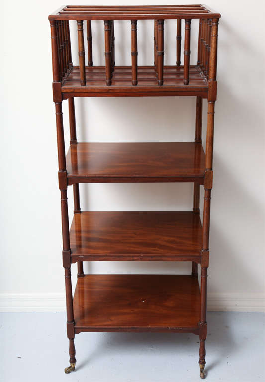 Mahogany four tier etagere w/three compartment top shelf on casters.