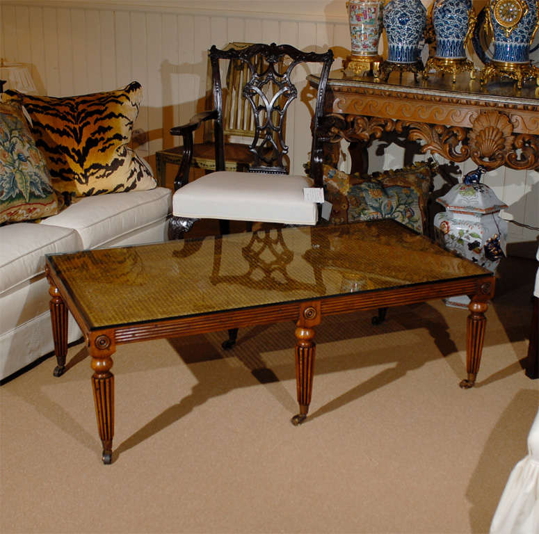Custom made English Regency style, cane top, reeded leg coffee table on castors with glass top polished edge.
