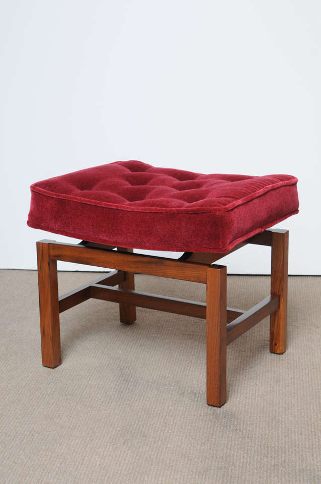 That Jens RISOM Ottoman is a great example of mid century danish modern design. Walnut Frame and a beautiful red Mohair upholster Floating Top is solid and sturdy with beautiful wood grain. Perfect size that will work well in many rooms.

 