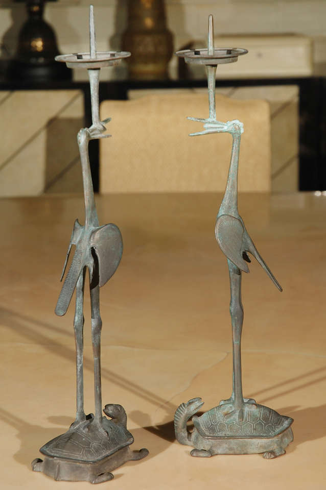 Pair Chinese bronze candle holders featuring cranes with tortoise.