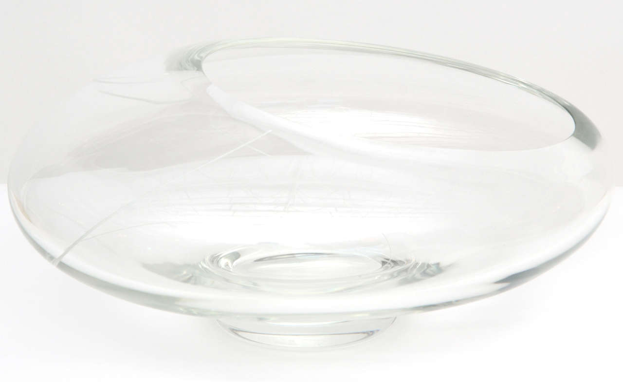 Substantial and unique signed bowl / vase by Seguso is a hand-blown clear Murano glass ellipse with an asymmetric opening and thin white ribbon detail. 