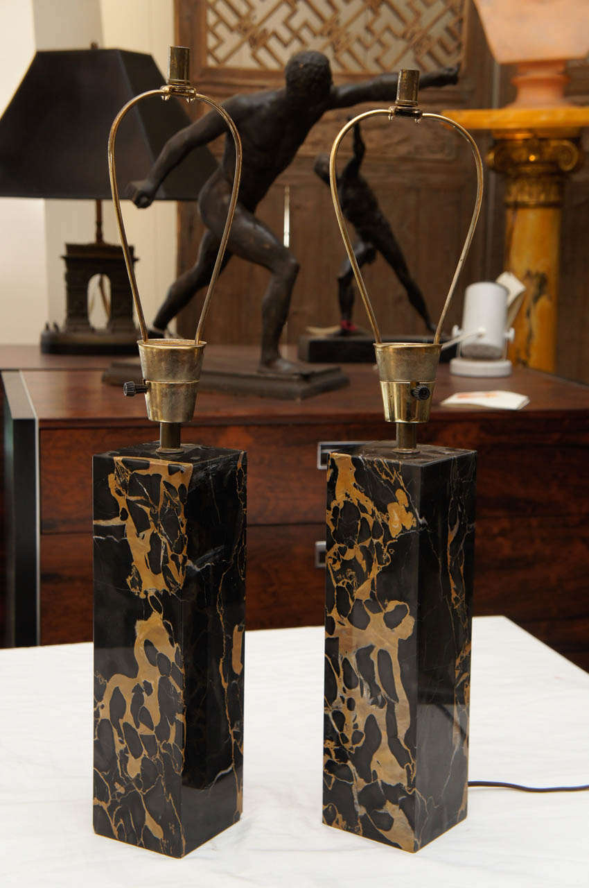 A pair of table lamps with a marble base.