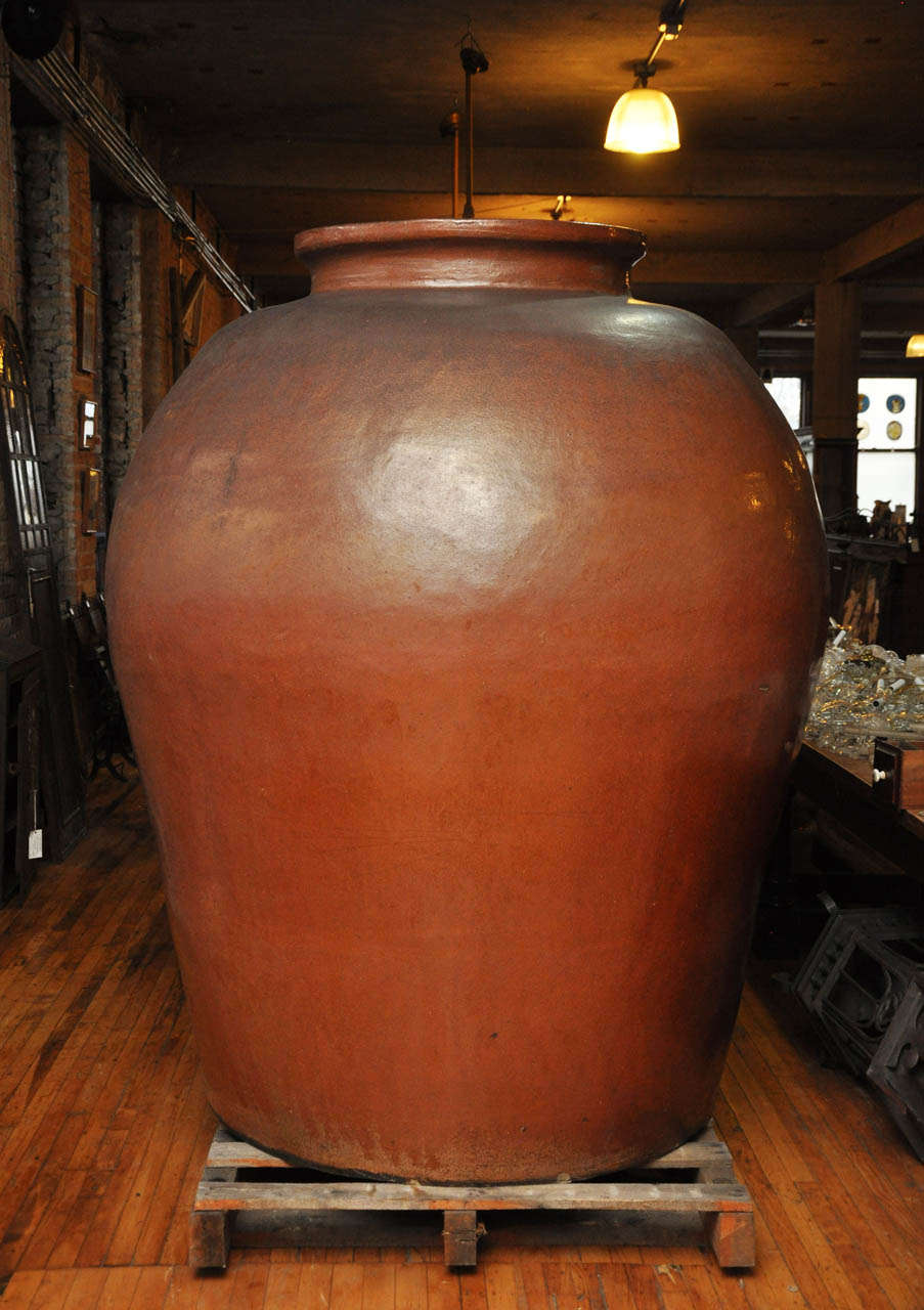 A nearly 6 foot tall terra cotta urn from a Pittsburgh steel mill, used for holding acid. Stamped “Universal Chemical Ware Acid Proof.” Two urns are available.