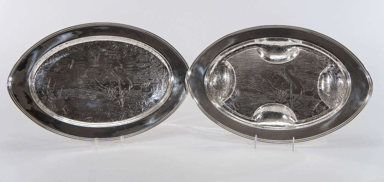 More known for their souvenir spoon production, this pair of platters exemplifies the fine engraving of this Bridgeport Ct. Silver manufacturer, Weidlich Brothers.
 One platter is completely flat and the other is a double well and tree with matched
