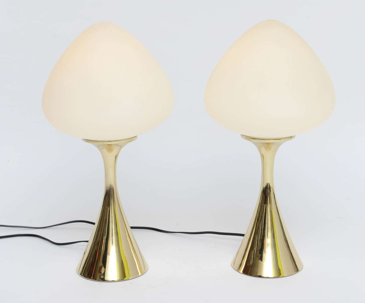 ..SOLD...1960s Lollipop lights, iconic modern table lamps from Laurel Lamp Co. with either brass or nickel tulip bases and blown satin glass globes.  Featuring three way sockets, rewired.  Globe shades made in Italy or