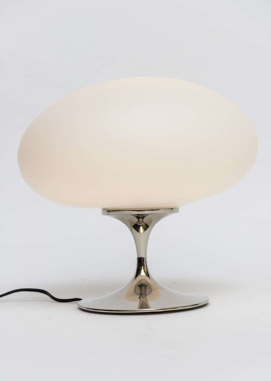 A 60s design classic with its Saarinen inspired tulip base in nickel topped by a blown satin glass mushroom globe shade, this table lamp by Laurel Lamp Co. is as fresh today as ever.  The lamp is rewired and has a three level porcelain socket. 