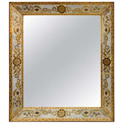 An Elegant Eglomise Mirror with Medallion and Leaf Motif
