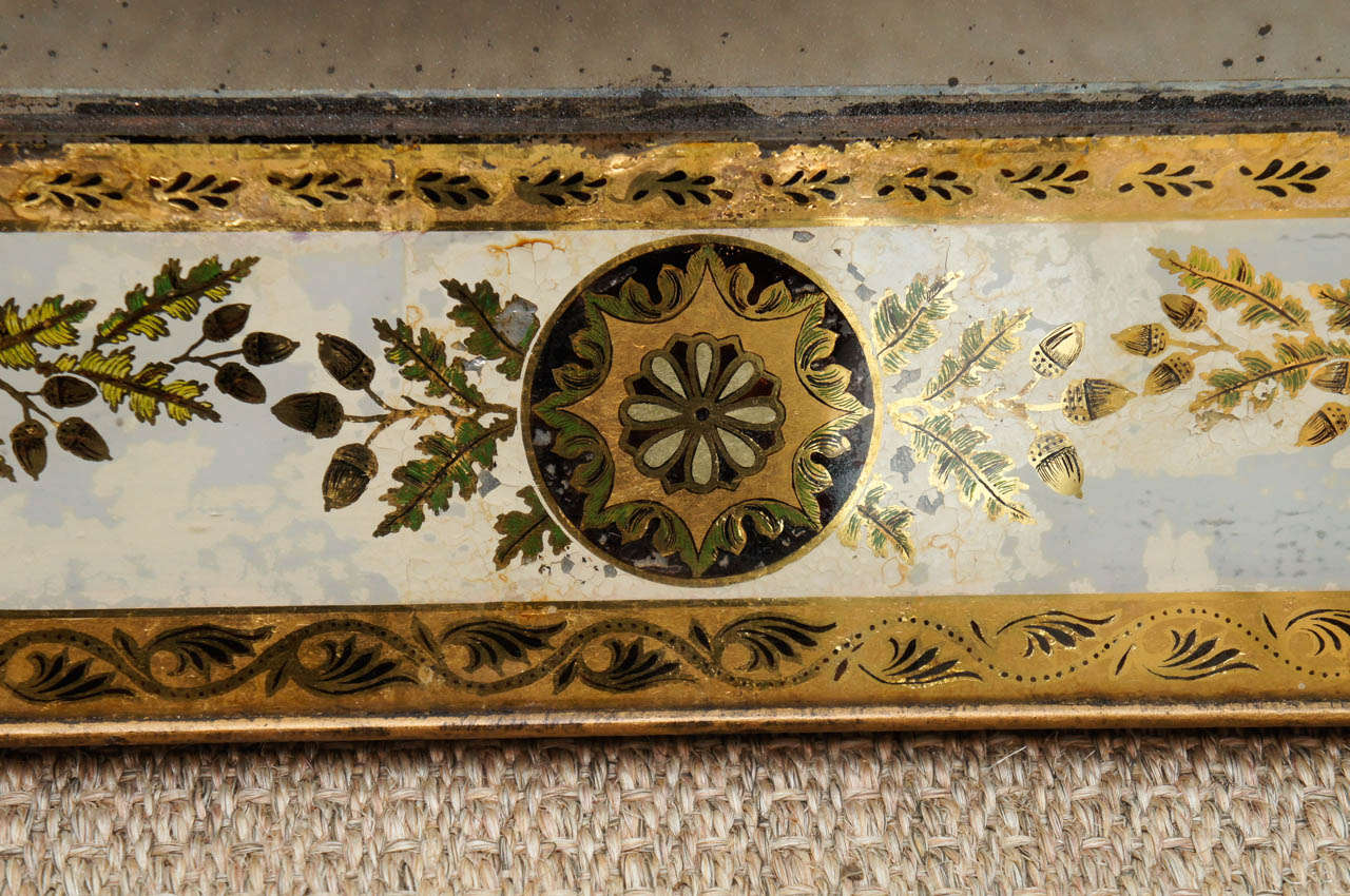 An Elegant Eglomise Mirror with Medallion and Leaf Motif In Excellent Condition For Sale In Hudson, NY