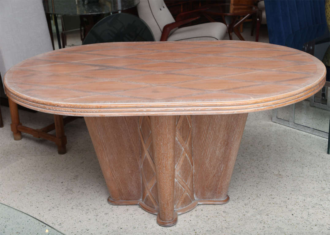 The oval top inlaid with diamond pattern over a quatropartite base with diamond motif.