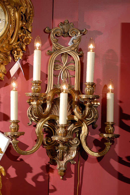 Pair of exquisite gilt bronze Regence style five-light sconces.