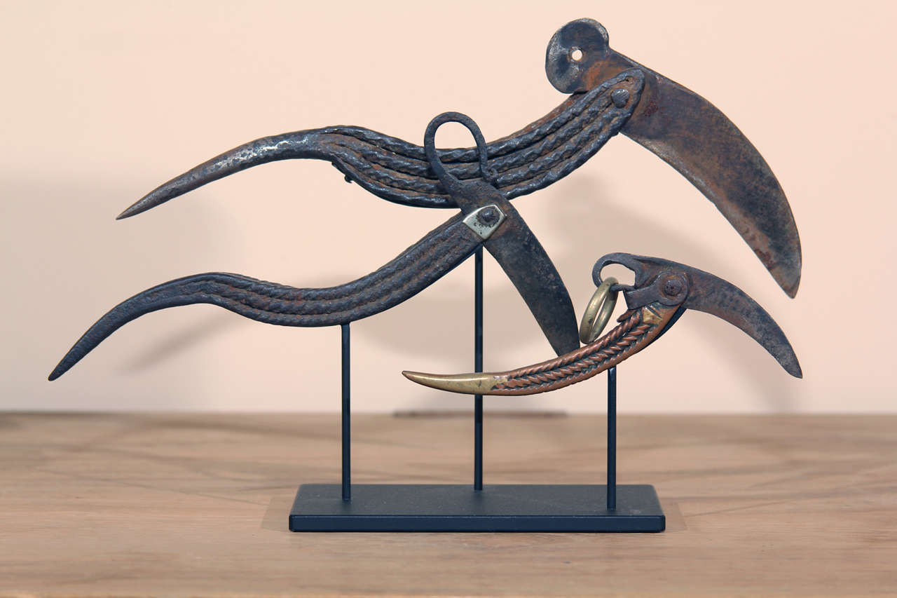 Set of three Chinese cast and forged iron horse hook picks and trimming blades from Shanxi province. Mounted on a contemporary stand.
Early 20th century.
7½