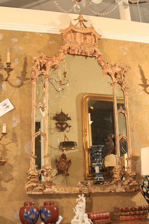 Large scale Chinoiserie Mirror with original glass. Stripped wood finish with vestiges of original gilding.