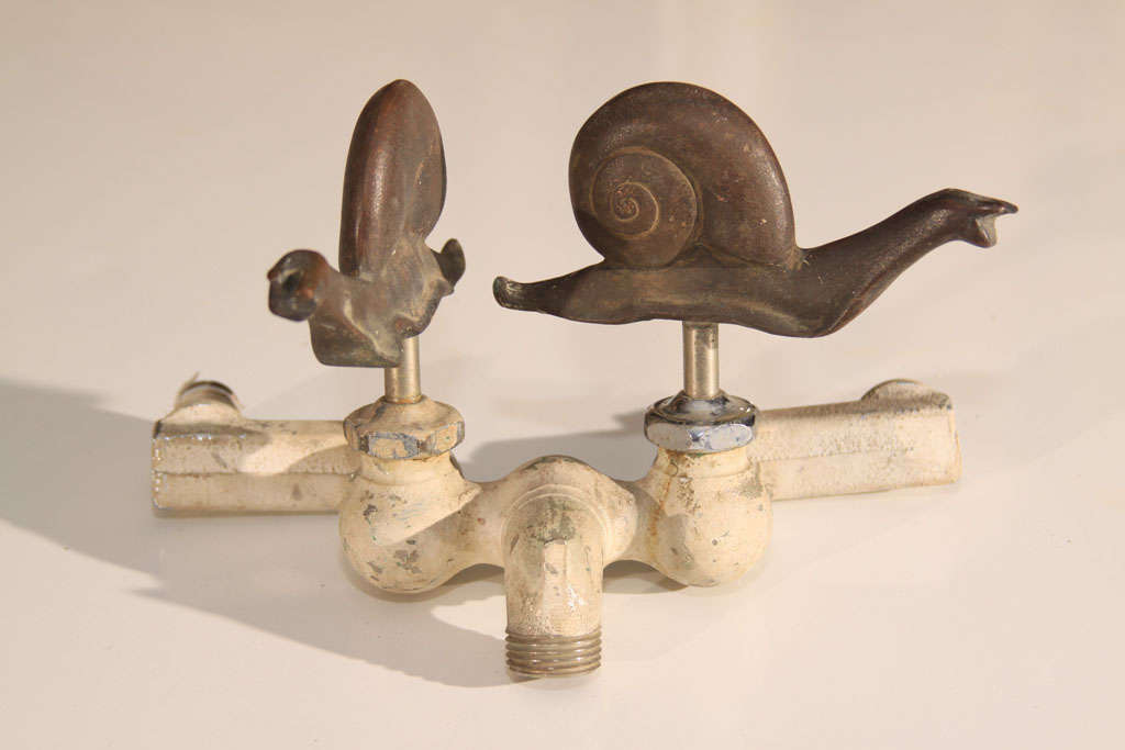 Garden faucet with working snail handles