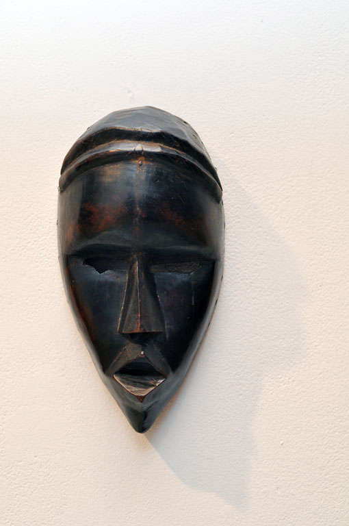 Dan Ceremonial Mask-<br />
<br />
These much-admired face masks are well known from Liberia and the Ivory coast.  The Dan people occupy a forest region.  The mask is worn by performers on public occasions for communal benefit.  The mask would be