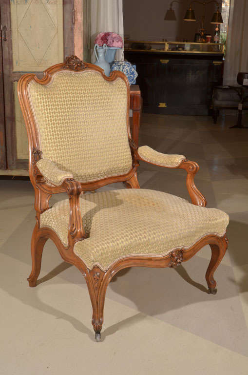 A Beautiful Provincial Louis XV Style Fruitwood Fauteuil, on casters.

Very gracious scale. With fine carving and geometric velvet upholstery.

A very fine example of the Louis XV Style. 