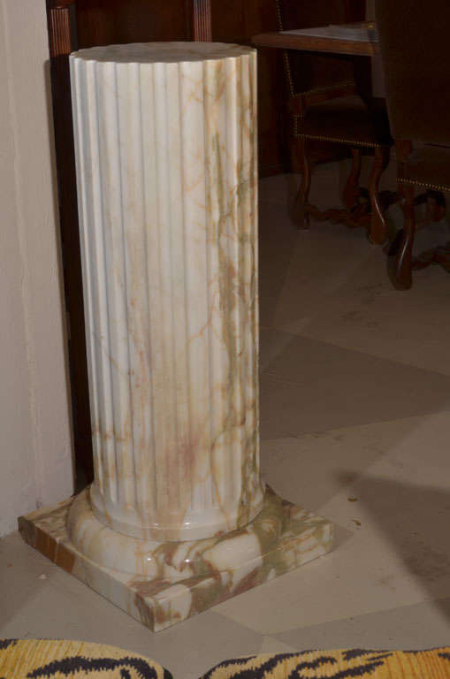 The fluted circular column supported by a square base 5