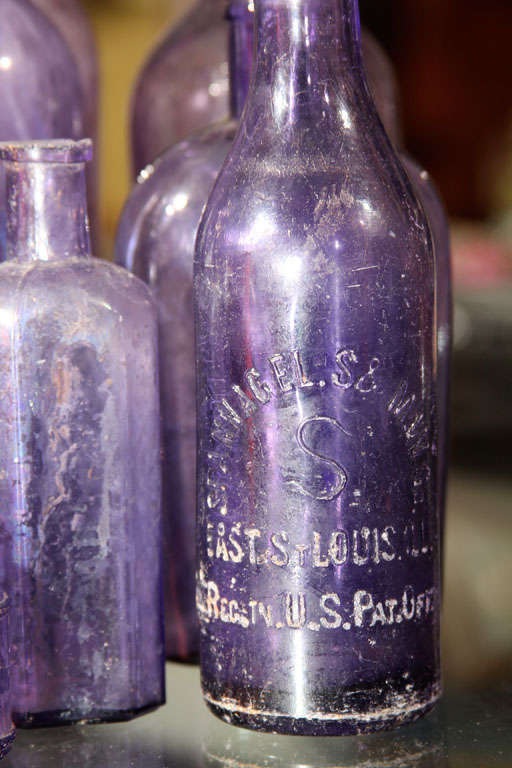 Glass collection of 11 purpling bottles
