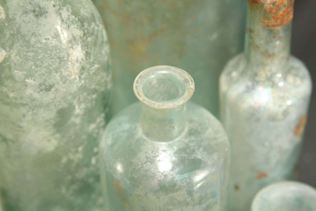 Glass set of 5 aqua bottles