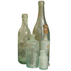 Antique set of 5 aqua bottles