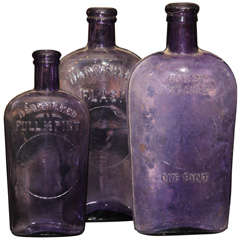 Antique set of 3 purple bottles