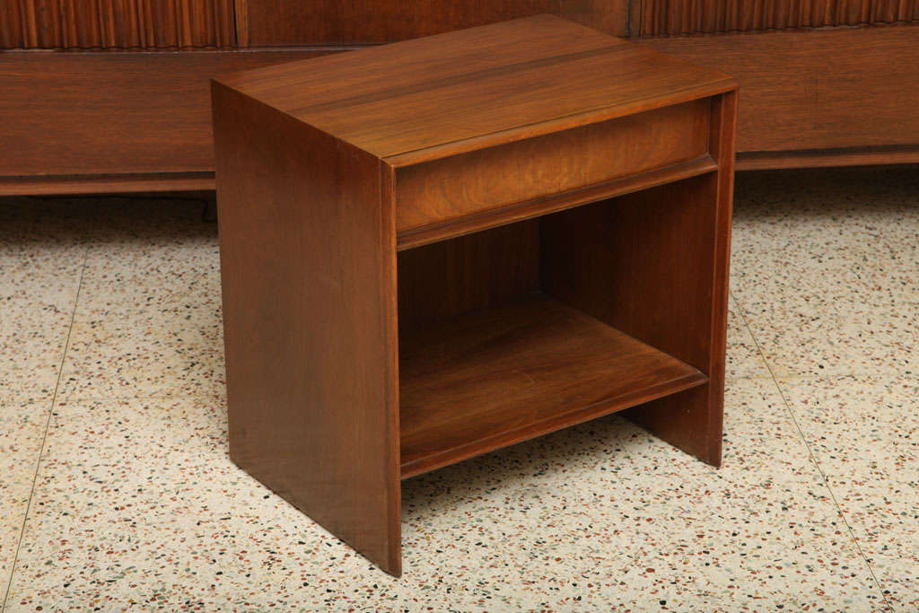 Beautifully figured walnut highlights this Robsjohn-Gibbings bedside table for Widdicomb. With an upper single drawer and open cubbyhole shelf below, perfect for a few favorite books. In very nice original condition, recently given a good polish