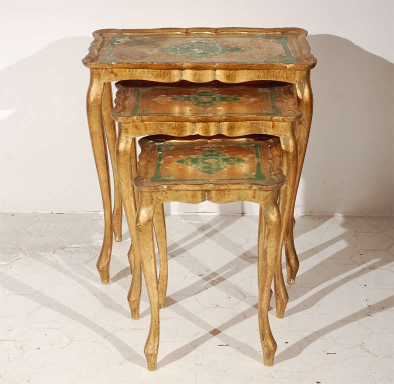 Beautiful set of three Venetian nesting tables in hand painted, gold leafed fir.  Measurements for smallest table is 13