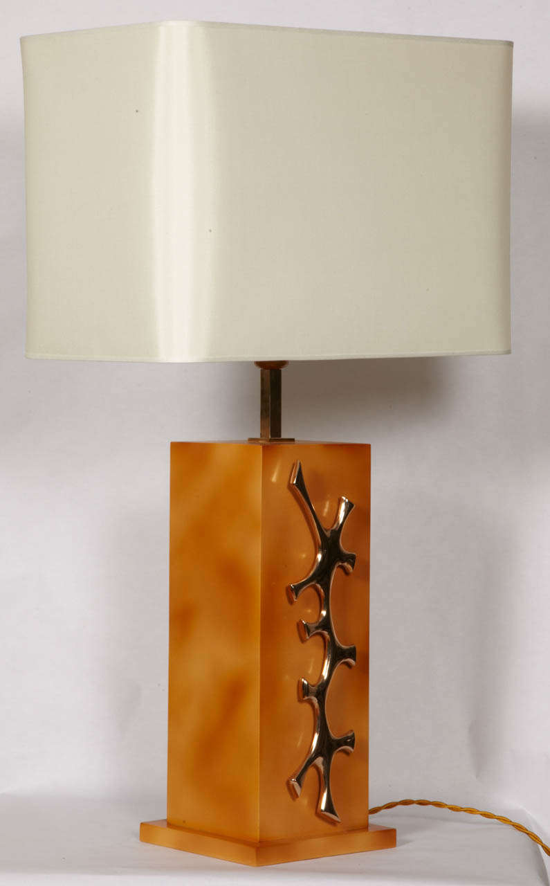Pair of lamps in lacquered wood and bronze.