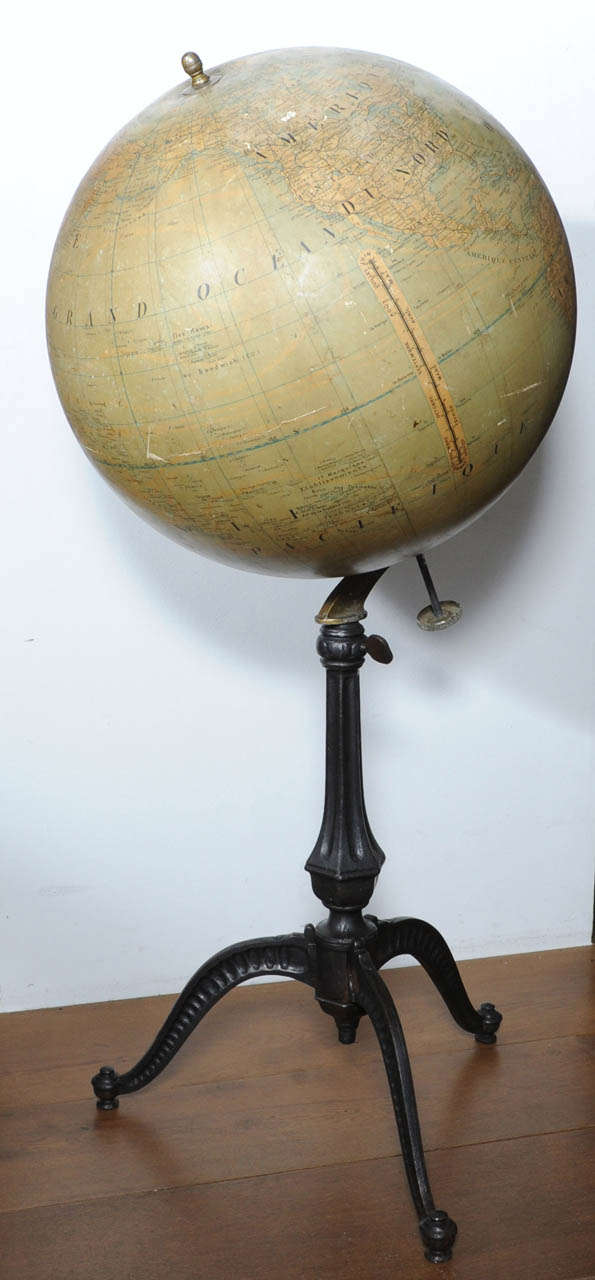 A large scale floor globe by Girard Barrère Paris on elevated cast-iron tripod.
